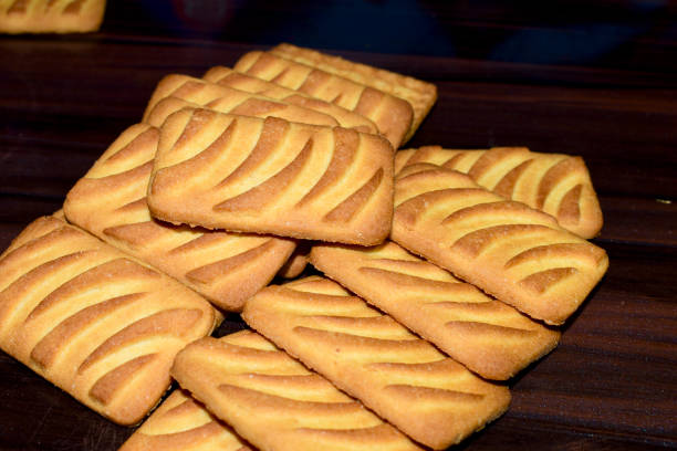 istock Cookies with milk on a tray on a rustic wooden table 1405785540