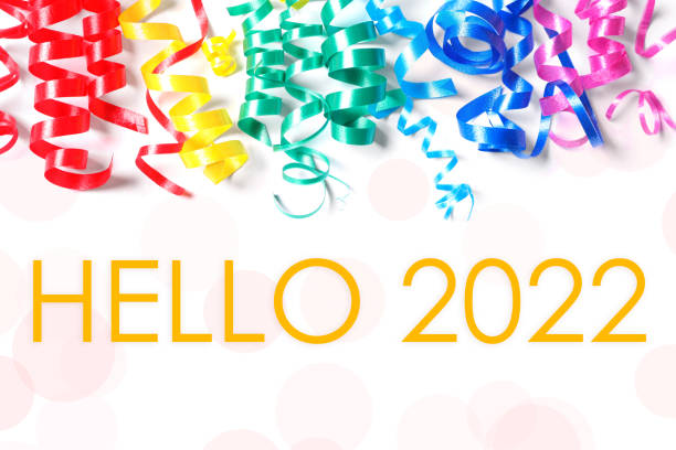 Text Hello 2022 and colorful serpentine streamers on white background, top view Text Hello 2022 and colorful serpentine streamers on white background, top view streamer photos stock pictures, royalty-free photos & images