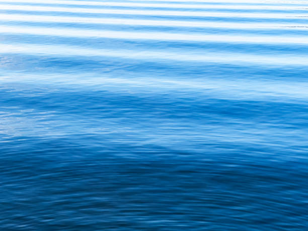 Gently Rolling Waves Clean and Fresh Blue hued water with gentle waves swaying sea wake stock pictures, royalty-free photos & images