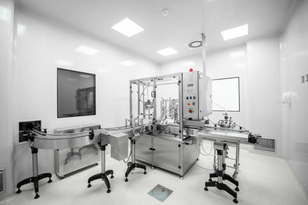 Pharmaceutical manufacturing machine in a white laboratory stock photo