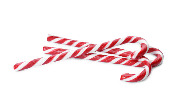 istock Delicious Christmas candy canes on white background 1405789292