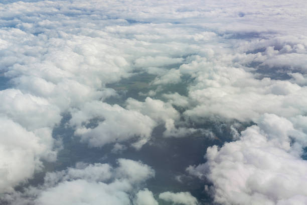 istock White clouds above green land aerial view 1405790443