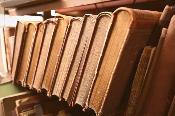 istock Collection of old books in library, closeup 1405790506