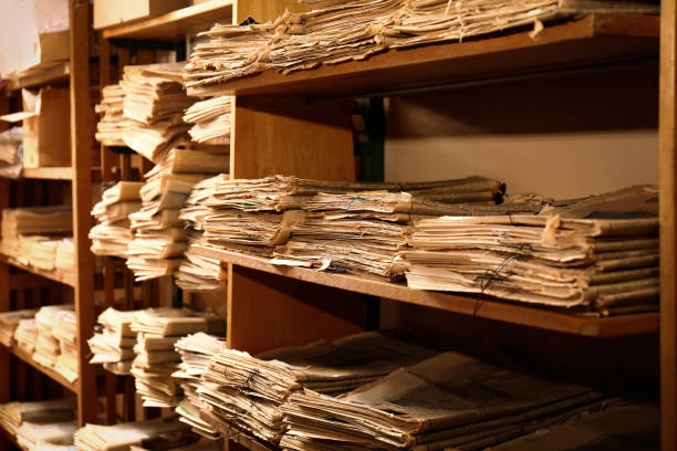 Collection of old newspapers on shelves in library