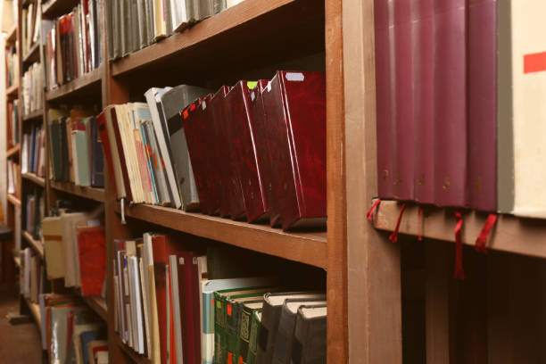 istock Collection of different books on shelves in library 1405790541