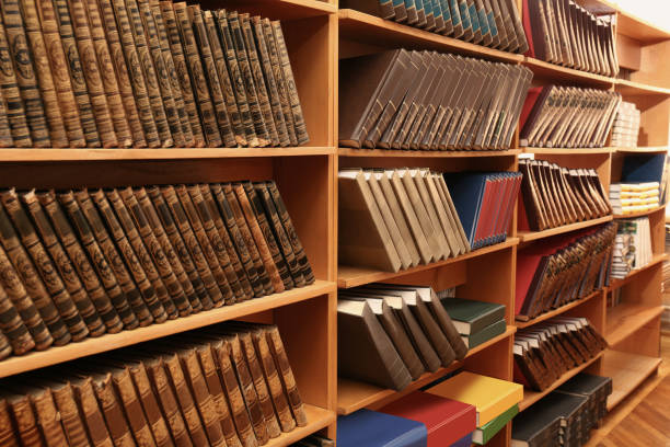 istock Collection of different books on shelves in library 1405790567