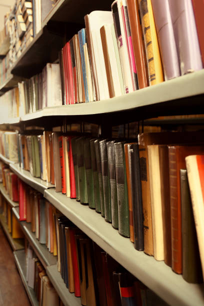 istock Collection of different books on shelves in library 1405790687