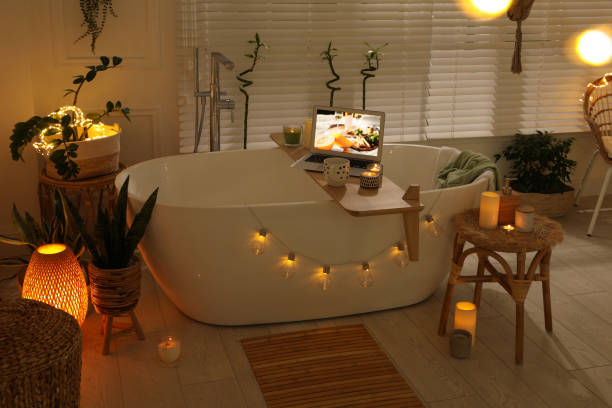 istock Stylish bathroom interior with green houseplants and string lights. Idea for design 1405792437
