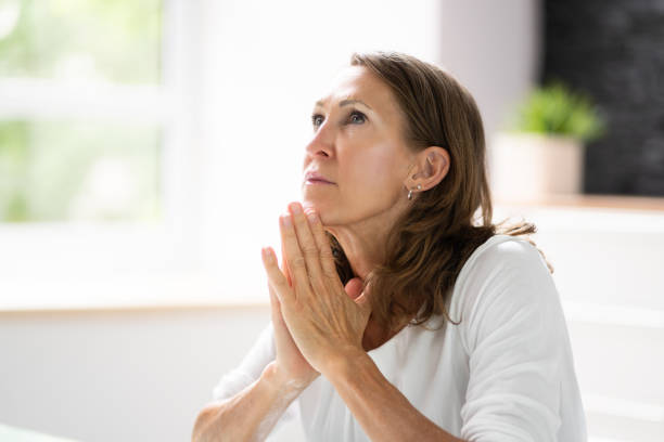 istock Praying Woman 1405792744
