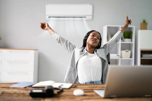 istock Businesswoman Working In Office With Air Conditioning 1405793213