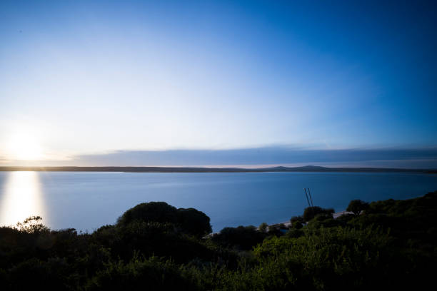 Early morning sunlight across calm lagoon