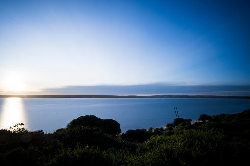 Early morning sunlight across calm lagoon