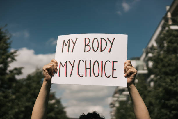 Abortion Protest Woman holding a sign "My Body, My Choice reproductive rights stock pictures, royalty-free photos & images