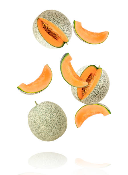 melon or cantaloupe (cucumis melo) with cut slice flying in the air isolated on white - melon imagens e fotografias de stock