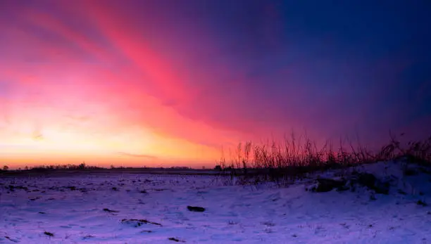 Spectacular Winter sunrise over flat agricultural land in the Fens in the East of England, Spalding, Lincolnshire.