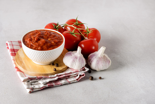 Composition with Fresh Tomatoes and Garlic Sauce Wooden Background Space for Text Ripe Vegetables Helathy Organic
