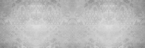 Photo of Old gray grey white vintage shabby damask patchwork tiles stone concrete cement wall texture background banner