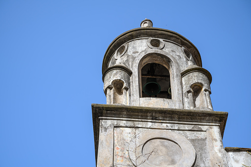 Rosario, Moita, Setubal District, Portugal: blue sky and gable belfry of the Rosario chapel, dedicated to S. João Evangelista, built in 1532 by nobleman Cosmo Bernardes de Macedo. Chapel of Our Lady of the Rosary / Chapel of Our Lady of the Rosary.