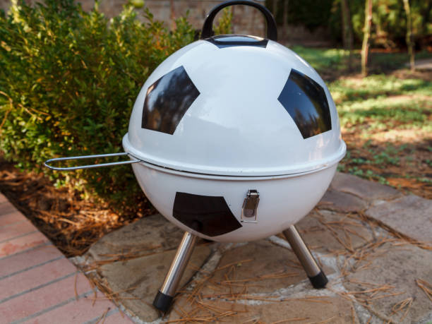 Soccer ball shaped metal barbecue