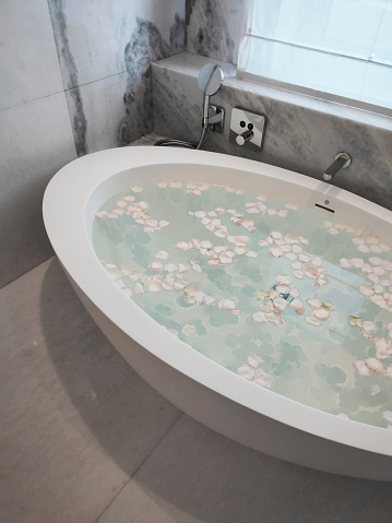 Close up chrome faucet shower bath tub room interior design