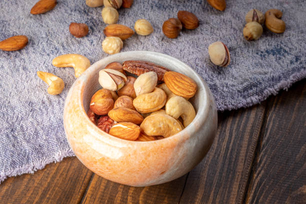 istock Cashew, almond, peanut, walnut nuts in a bowl 1405805589