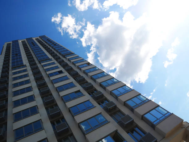 istock high-rise building in perspective against the sky view from below 1405806785