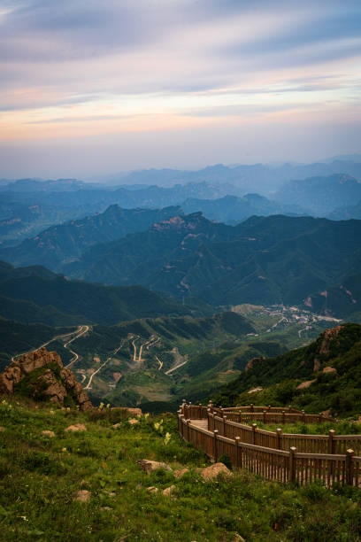 istock Beautiful view on the mountains from the top through the clouds 1405806901