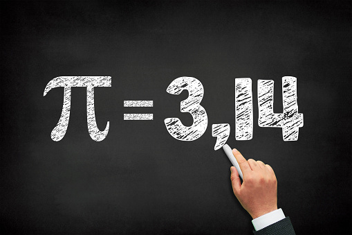 Pi number, hand writing the mathematical sign on chalkboard