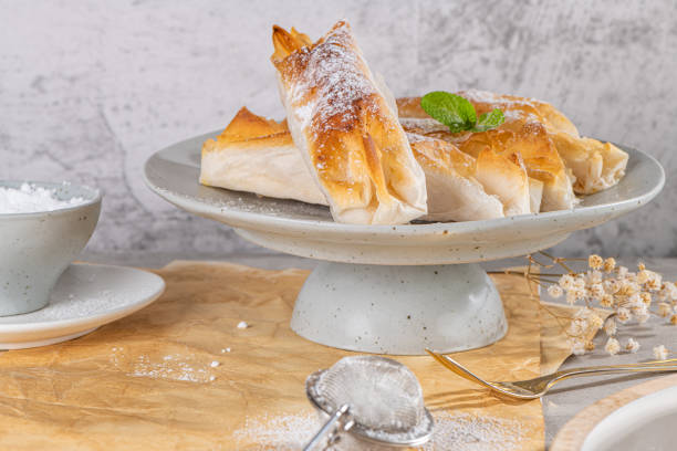 istock Typical portuguese sweets Pasteis de Vouzela served on countertop. Filo pastry with egg cream filling 1405809938