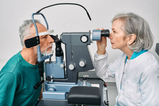 istock Optometrist doing sight test for senior man at modern ophthalmology clinic. Eye exam and vision diagnostic 1405810580