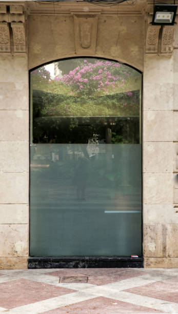 istock Garden reflected on shop window glass 1405810742