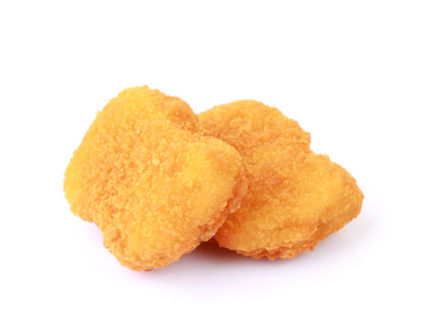 istock Chicken nuggets closeup isolated on white background 1405811393