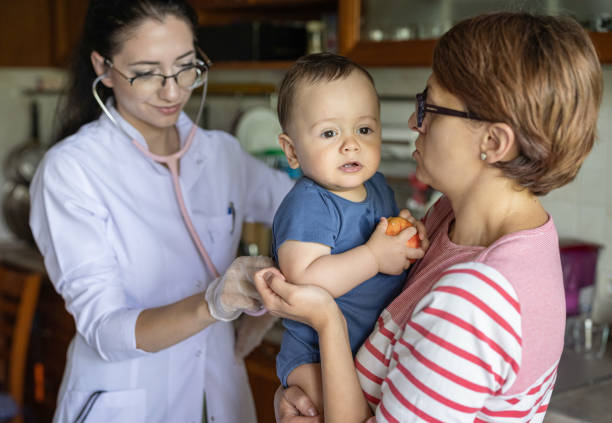 istock Little baby boy getting examined 1405812983