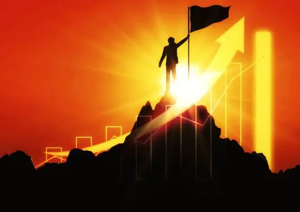 Silhouette illustration of a businessman standing on the mountaintop with the concept of success