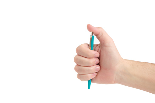 Pressing mechanical button ballpoint pen with your thumb, on white background