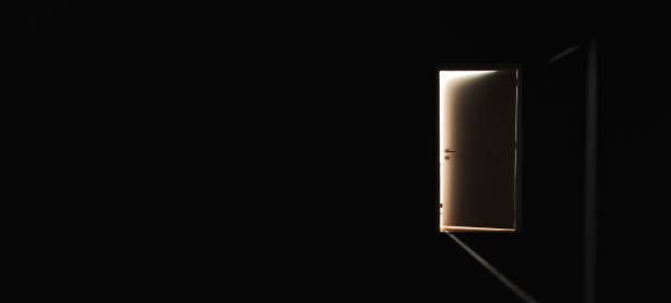 istock Door to the light in a dark 1405823417