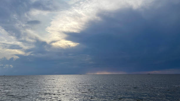 istock Sunset by the ocean 1405826058