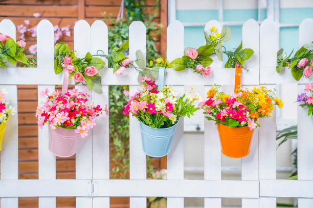istock Hanging Flower Pots with fence 1405827843
