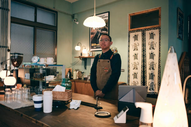 istock Cafe owner happy smiling looking at camera 1405829467