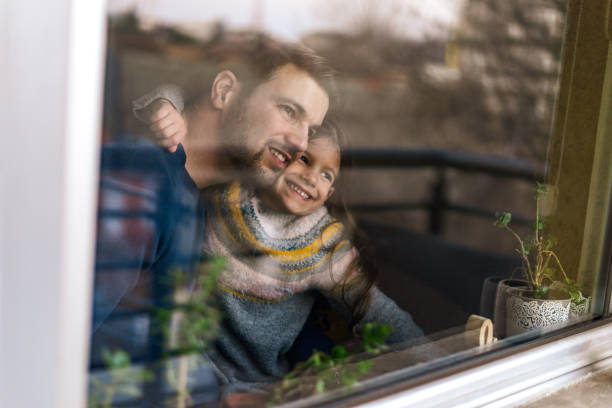 istock Smiling loving adorable little daughter hugging her father 1405830175