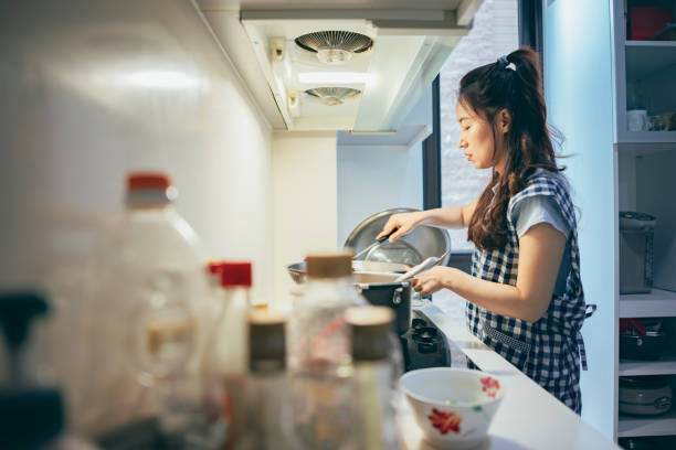 istock A young Asian mother prepares dinner 1405831371
