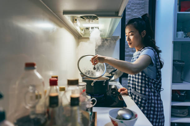 istock A young Asian mother prepares dinner 1405831373
