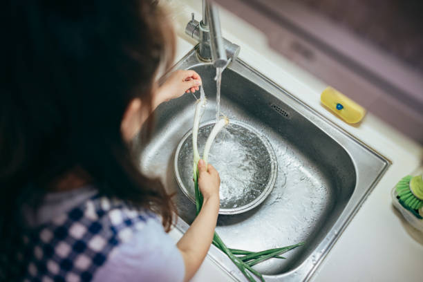 istock A young Asian mother prepares dinner 1405831374