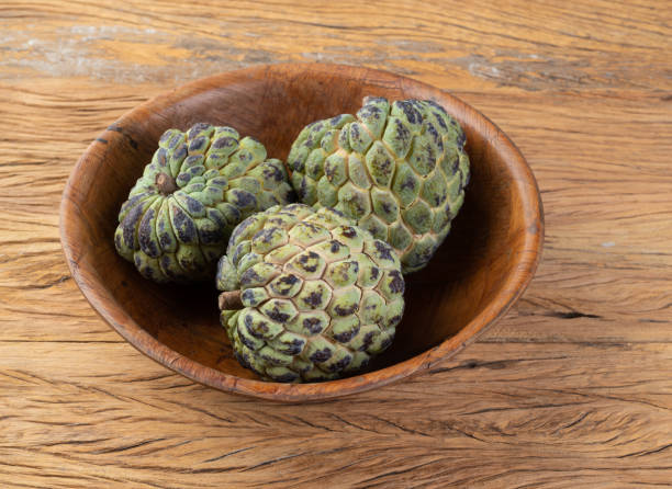 istock Sugar apples or custard apples in a bowl over wooden table 1405832792