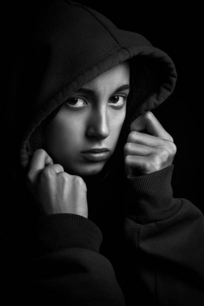 istock sad girl in hood 1405836001