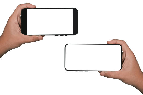 Businessman hand holding black smartphone isolated on white background, white clipping path inside.