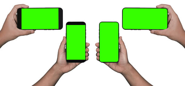 Businessman hand holding black smartphone isolated on white background, white clipping path inside.