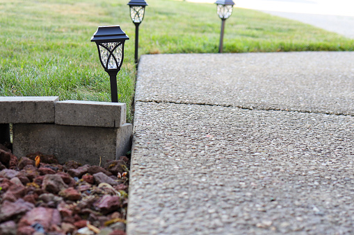Close up of solar landscaping lights in a lawn