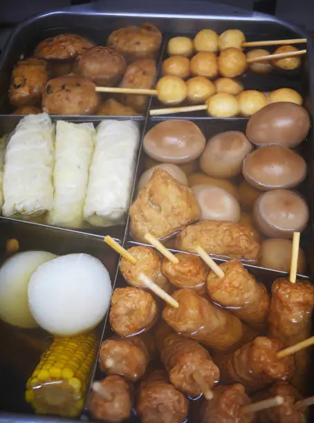 Japanese traditional Oden, Various ingredients, boiled eggs, daikon, konjac, fishcakes stewed in a light, soy-flavored dashi broth