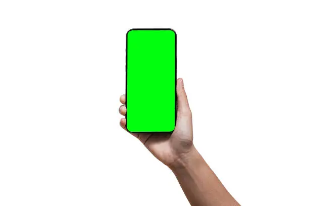 Businessman hand holding black smartphone isolated on white background, green screen background - Clipping Path. iPhone 14